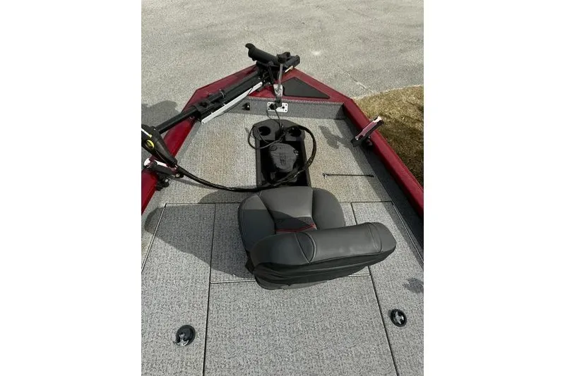 Slide: The Image of 2022 Tracker Pro Team 175 TXW boat interior with seating and control panel. - 8