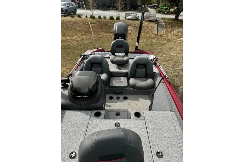 Slide: The Image of 2022 Tracker Pro Team 175 TXW boat interior with seating and motor. - 9