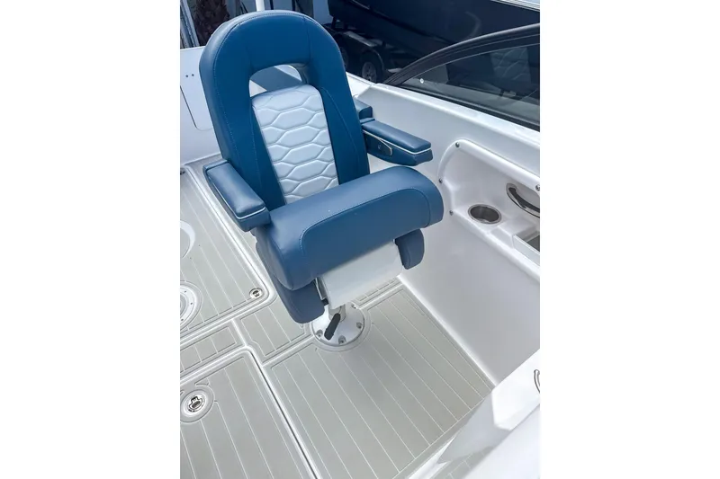Slide: The Image of 2024 Aquasport AS DC 22 boat seat with blue and white upholstery. - 13