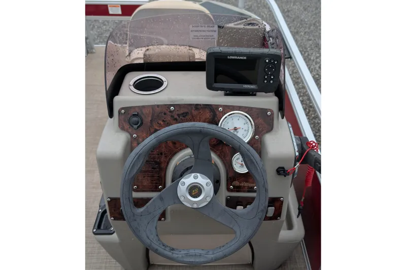 Slide: The Image of 2023 Sun Tracker Party Barge 18 steering console with gauges and Lowrance fishfinder. - 4