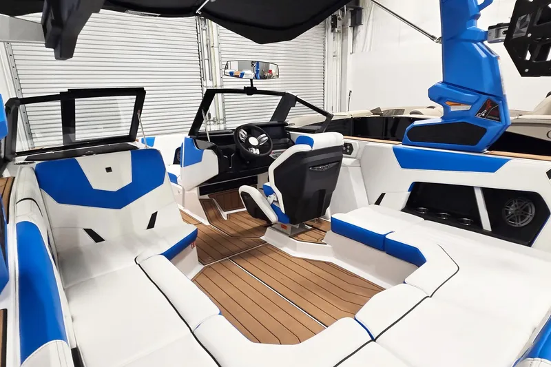 Slide: The Image of 2026 Nautique Super Air Nautique GS20 interior with blue and white seating, modern design. - 6