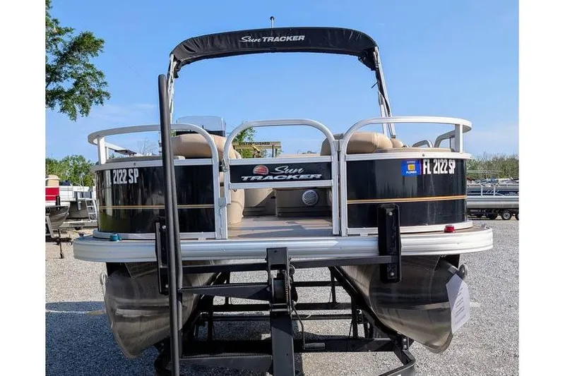 Slide: The Image of 2020 Sun Tracker Bass Buggy 18 Classic Series pontoon boat on trailer. - 3