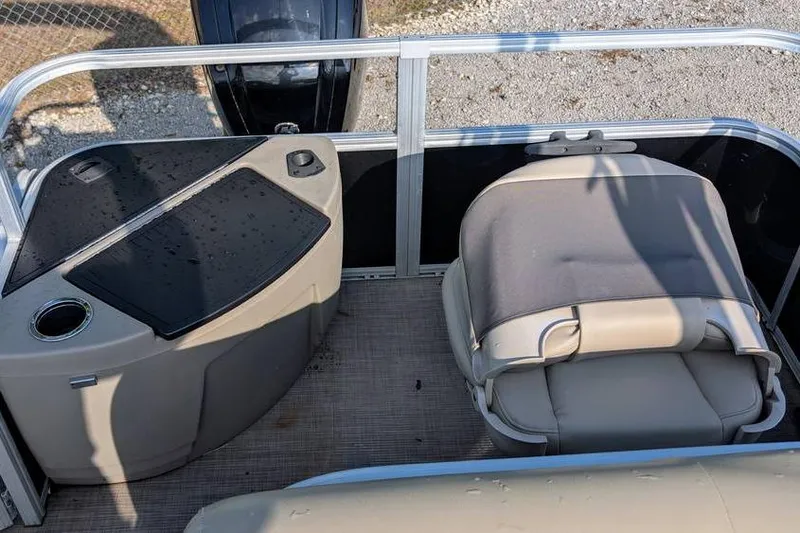 Slide: The Image of 2020 Sun Tracker Bass Buggy 18 Classic Series boat interior with seating and console. - 7