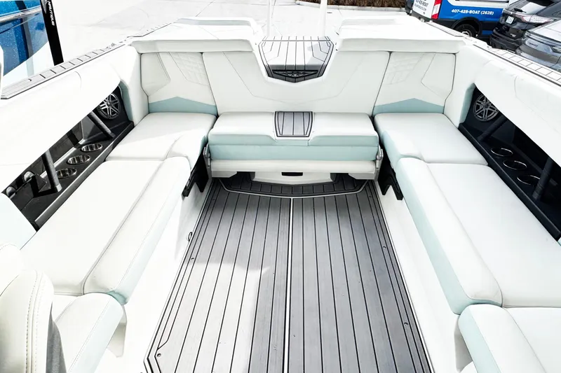 Slide: The Image of 2023 Nautique Super Air Nautique S25 interior with spacious seating and modern design. - 10