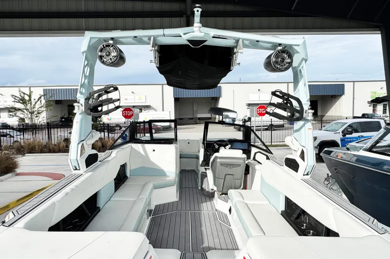 Slide: The Image of 2023 Nautique Super Air Nautique S25 interior with spacious seating and modern design. - 15