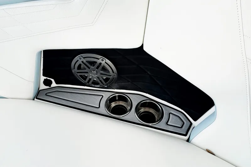 Slide: The Image of 2023 Nautique Super Air Nautique S25 interior with speaker and cup holders. - 8