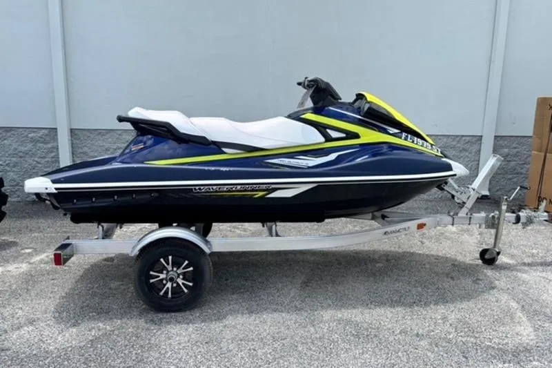 The Image of 2020 Yamaha WaveRunner VX Deluxe on trailer, blue and yellow design. - 0