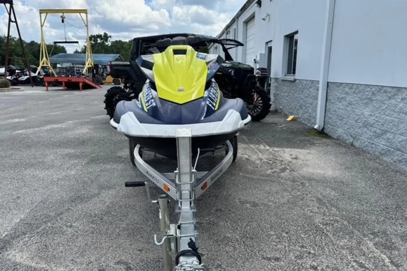 Slide: The Image of 2020 Yamaha WaveRunner VX Deluxe on trailer, parked outdoors near a building. - 2