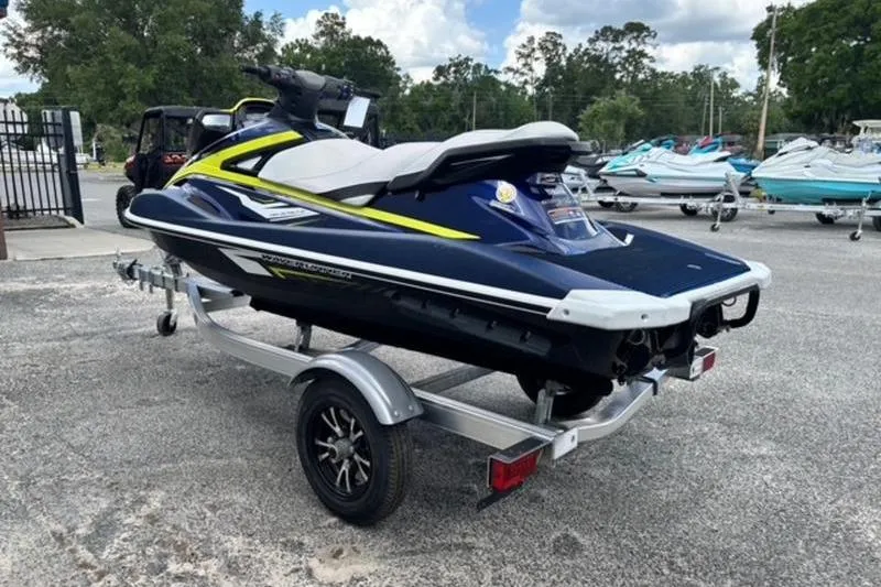 Slide: The Image of 2020 Yamaha WaveRunner VX Deluxe on trailer, parked outdoors with other watercraft. - 5
