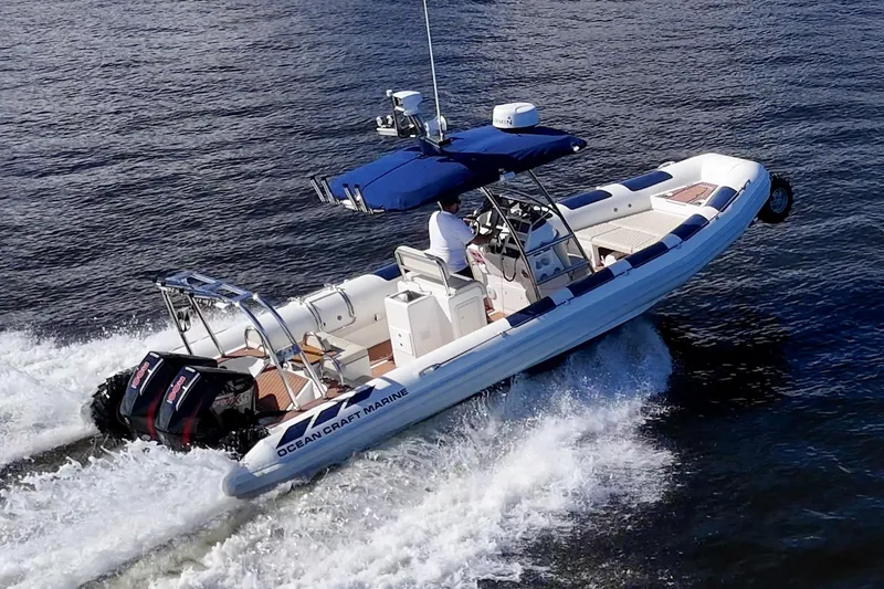 The Image of 2023 Ocean Craft 38 boat cruising on open water with dual engines. - 1