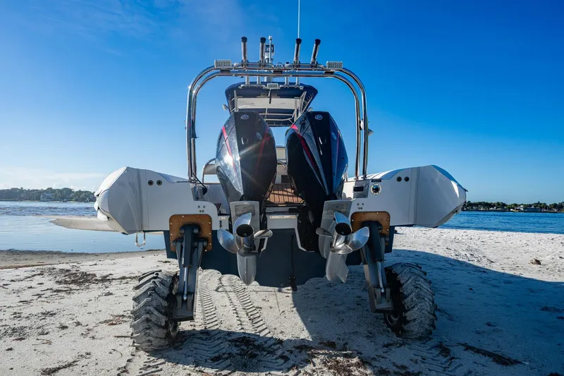 Slide: The Image of 2023 Ocean Craft 38 amphibious boat on sandy beach with dual engines. - 15