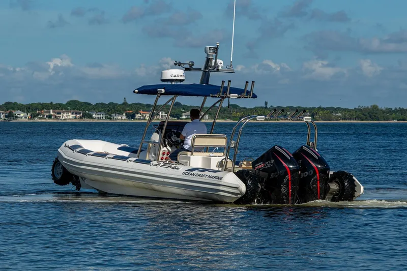 Slide: The Image of 2023 Ocean Craft 38 boat with dual engines cruising on a sunny day. - 20