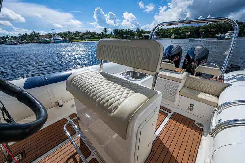 Slide: The Image of Luxurious interior of 2023 Ocean Craft 38 boat with plush seating and dual engines. - 7