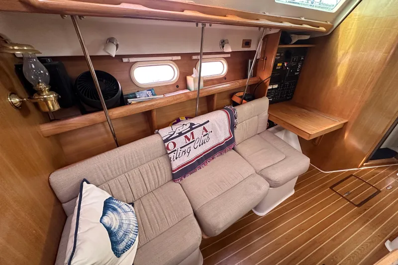 Slide: The Image of Interior of a 2006 Catalina 387 sailboat with cozy seating and nautical decor. - 33