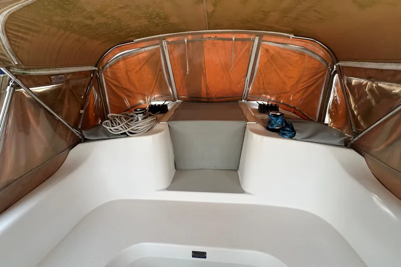 Slide: The Image of Interior of 2006 Catalina 387 sailboat with ropes and winches under a canopy. - 5
