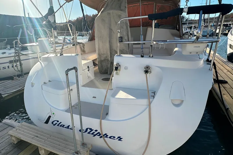 Slide: The Image of Catalina 387 sailboat from 2006, named "Glass Slipper," docked at a marina. - 7