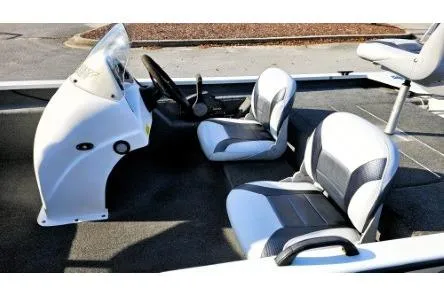 Slide: The Image of 2014 Alumacraft Pro 165 boat interior with dual seats and steering console. - 10