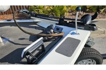 Slide: The Image of 2014 Alumacraft Pro 165 boat with trolling motor and trailer, parked outdoors. - 12