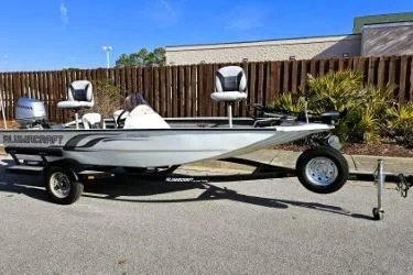 Slide: The Image of 2014 Alumacraft Pro 165 fishing boat on trailer, parked outdoors. - 3