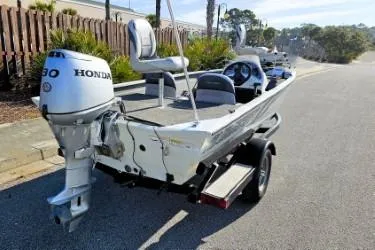 Slide: The Image of 2014 Alumacraft Pro 165 boat with Honda outboard motor on a trailer. - 6