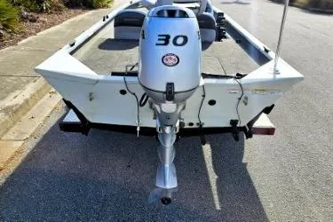 Slide: The Image of 2014 Alumacraft Pro 165 boat with 30 HP outboard motor, rear view. - 7