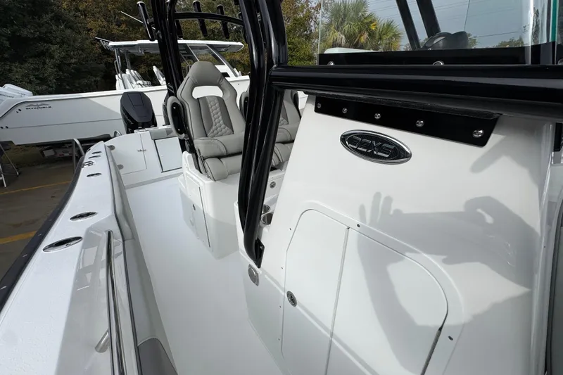 Slide: The Image of 2026 Cape Horn 32 XS boat interior with seating and console details. - 25