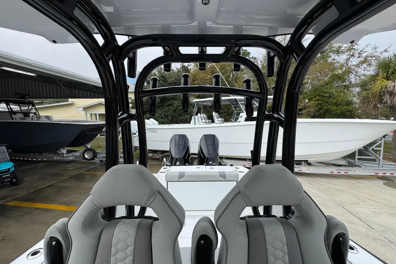 Slide: The Image of 2026 Cape Horn 32 XS boat interior with sleek seating and rod holders. - 34