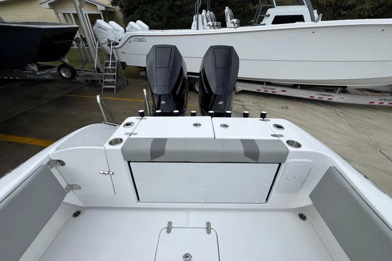 Slide: The Image of 2026 Cape Horn 32 XS boat with dual outboard engines, docked on a trailer. - 40