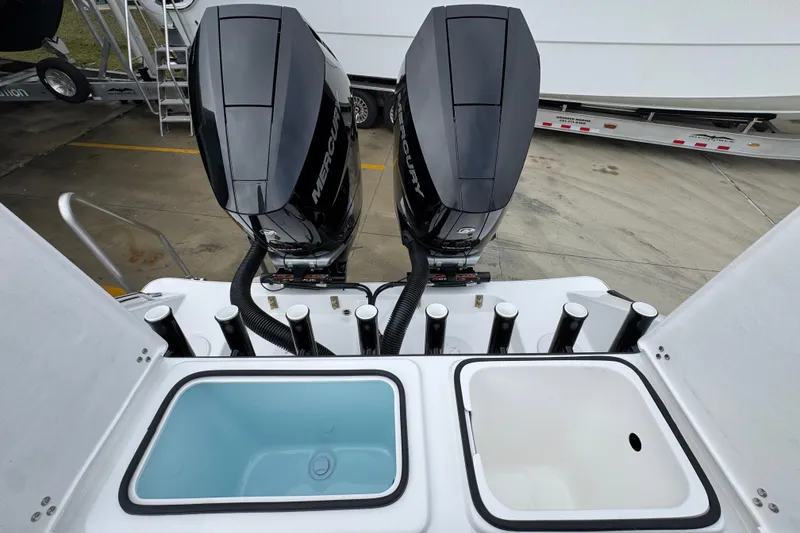 Slide: The Image of 2026 Cape Horn 32 XS boat with dual Mercury outboard engines and storage compartments. - 42