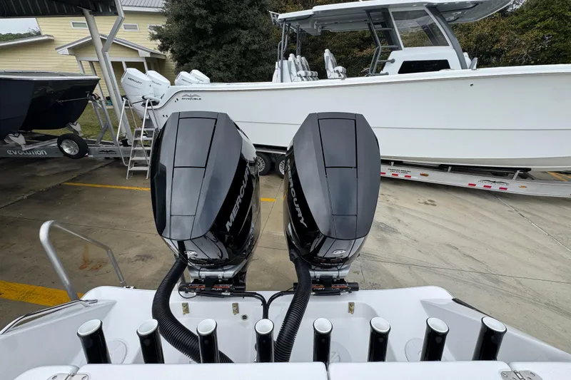 Slide: The Image of 2026 Cape Horn 32 XS boat with dual Mercury outboard engines on a trailer. - 43