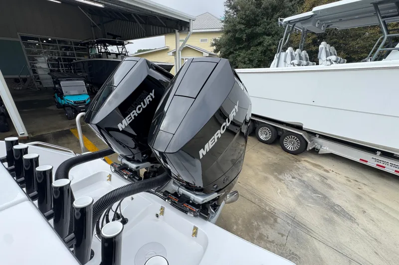 Slide: The Image of 2026 Cape Horn 32 XS with dual Mercury outboard engines in a boatyard. - 44
