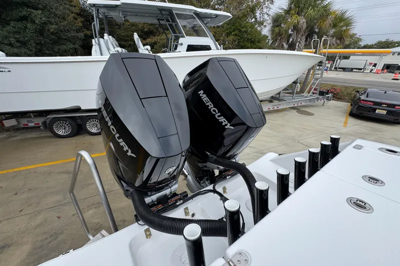 Slide: The Image of 2026 Cape Horn 32 XS boat with dual Mercury outboard engines, parked on a trailer. - 45