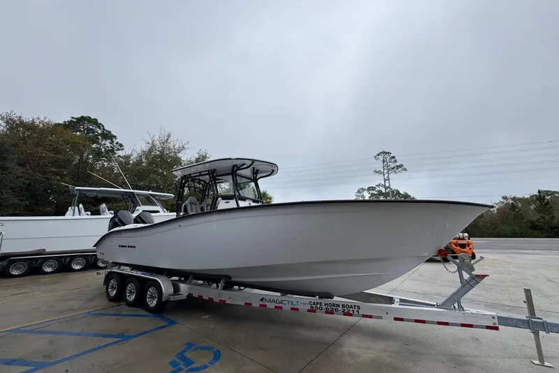 Slide: The Image of 2026 Cape Horn 32 XS boat on trailer in parking lot. - 6