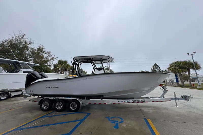 Slide: The Image of 2026 Cape Horn 32 XS boat on trailer in parking lot. - 8