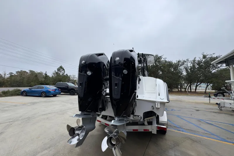 Slide: The Image of 2026 Cape Horn 32 XS boat with dual outboard engines on a trailer. - 12