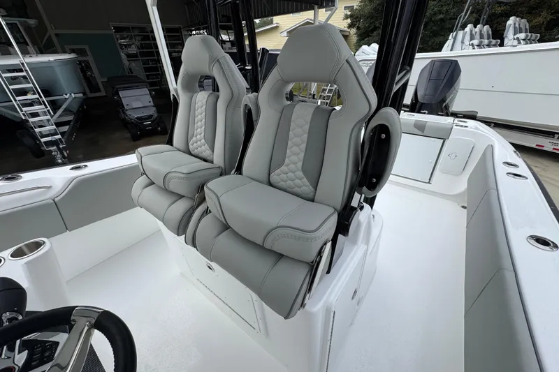 Slide: The Image of 2026 Cape Horn 32 XS boat interior with luxurious gray seating and modern design. - 32