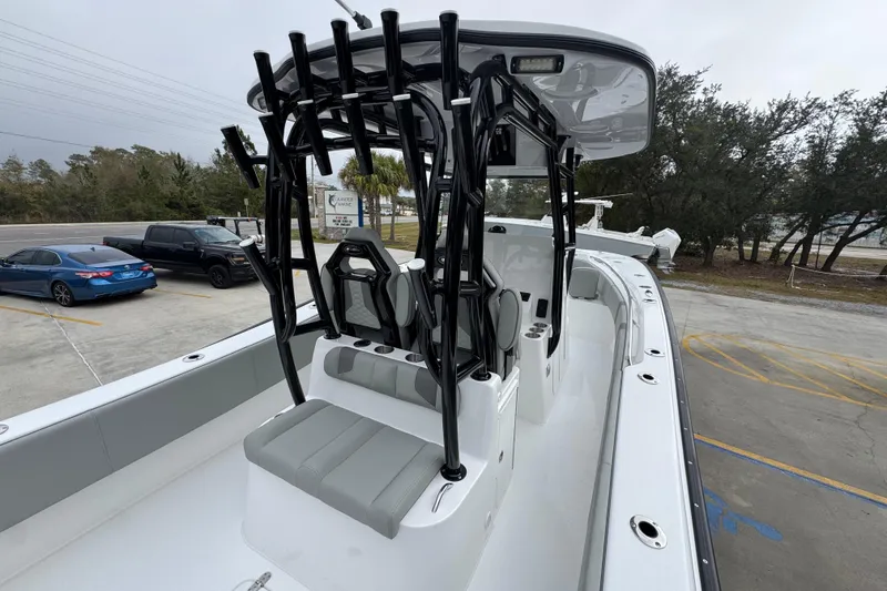 Slide: The Image of 2026 Cape Horn 32 XS boat with sleek design and modern seating in a parking lot. - 38