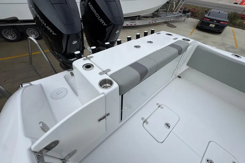 Slide: The Image of 2026 Cape Horn 32 XS boat interior with Mercury engines, featuring seating and storage compartments. - 41