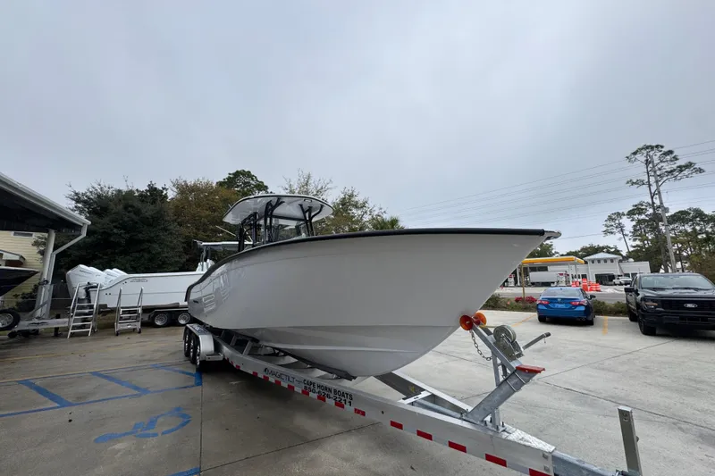Slide: The Image of 2026 Cape Horn 32 XS boat on trailer in parking lot. - 7