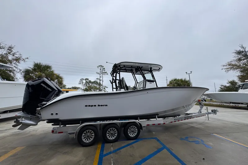 Slide: The Image of 2026 Cape Horn 32 XS boat on trailer in parking lot. - 9