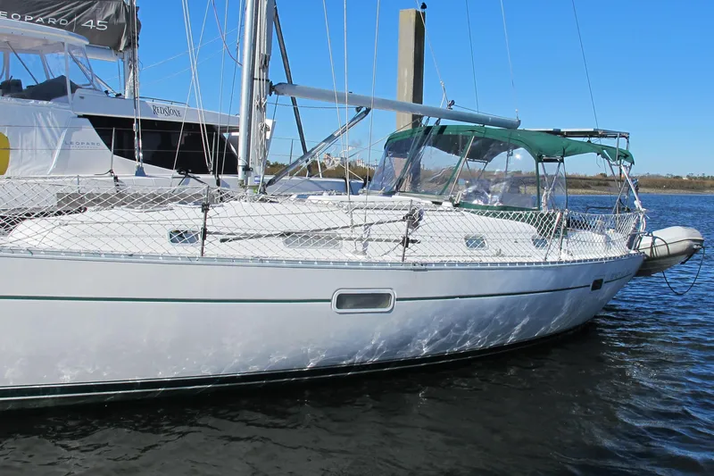 The Image of 2000 Beneteau Oceanis 361 sailboat docked on calm water. - 1