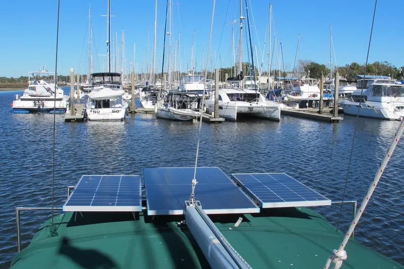 Slide: The Image of Beneteau Oceanis 361 sailboat with solar panels docked in a marina, 2000 model. - 11