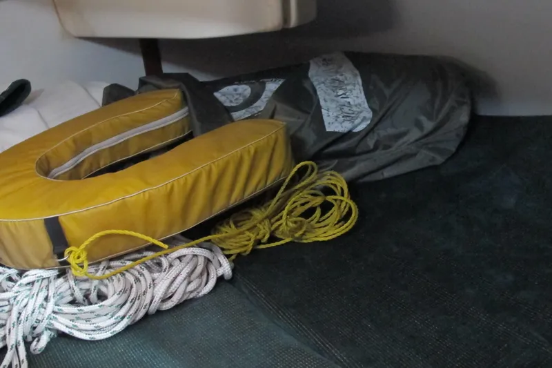 Slide: The Image of Yellow life preserver and ropes on Beneteau Oceanis 361 sailboat, 2000 model. - 19
