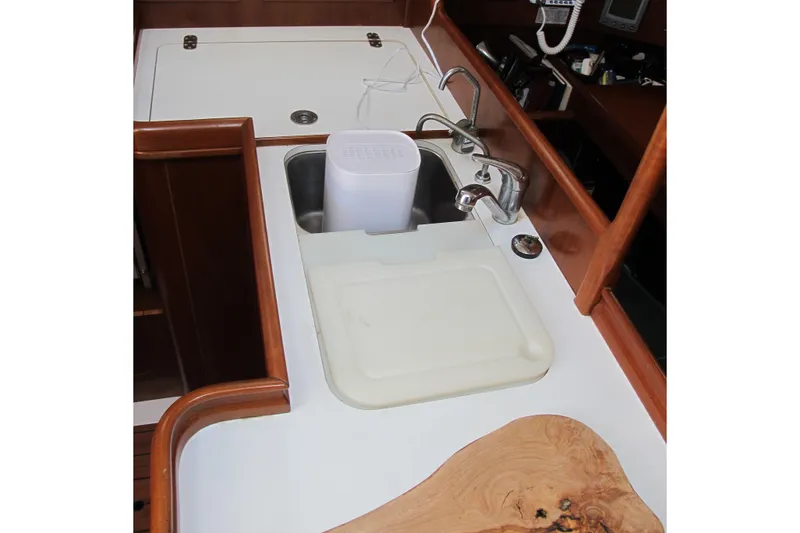 Slide: The Image of Beneteau Oceanis 361 yacht kitchen sink area with cutting board, 2000 model. - 20