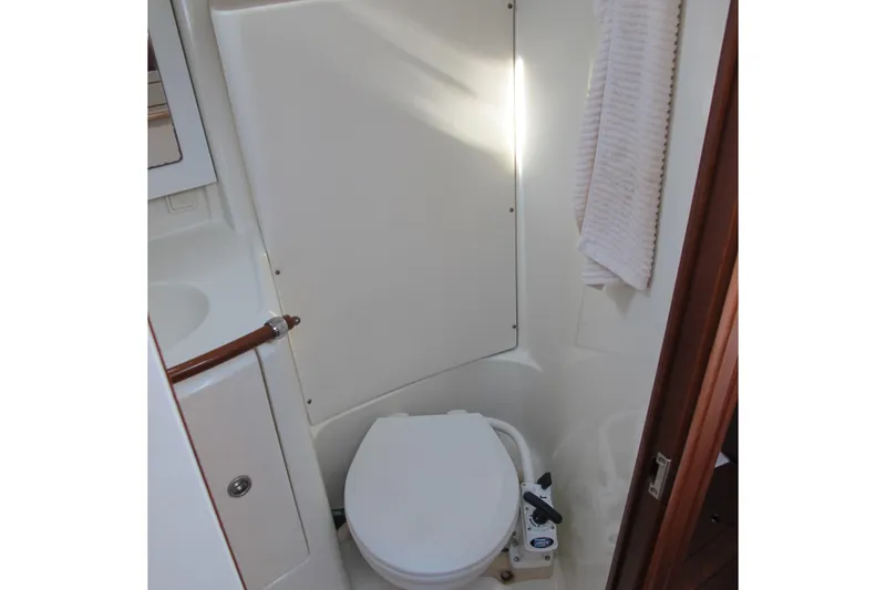 Slide: The Image of Beneteau Oceanis 361 (2000) yacht bathroom with toilet and towel. - 23