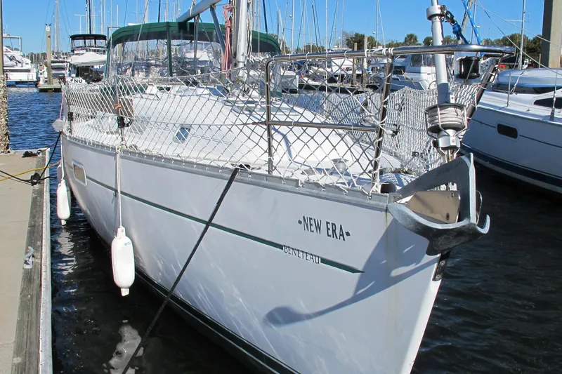 Slide: The Image of Beneteau Oceanis 361 sailboat docked, 2000 model, named "New Era" with visible anchor. - 3