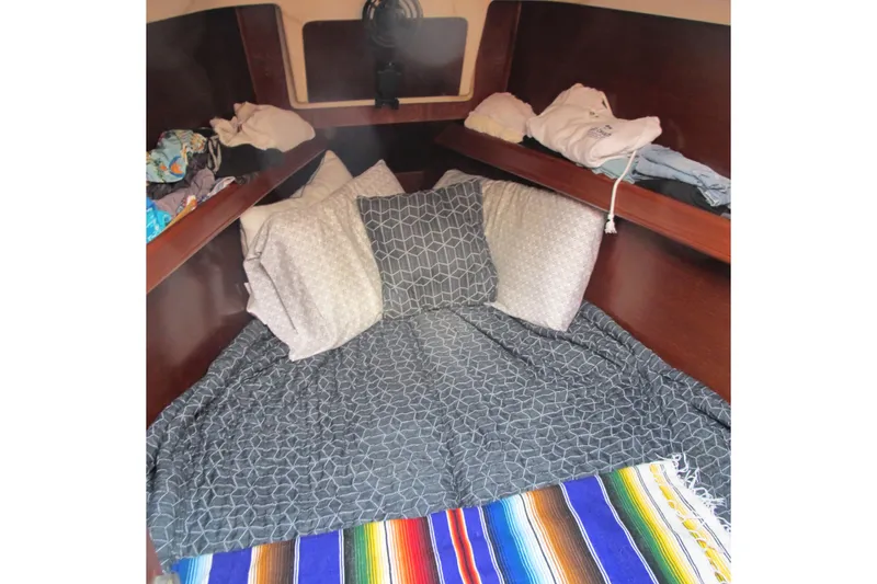 Slide: The Image of Cozy cabin interior of 2000 Beneteau Oceanis 361 sailboat with colorful bedding. - 30