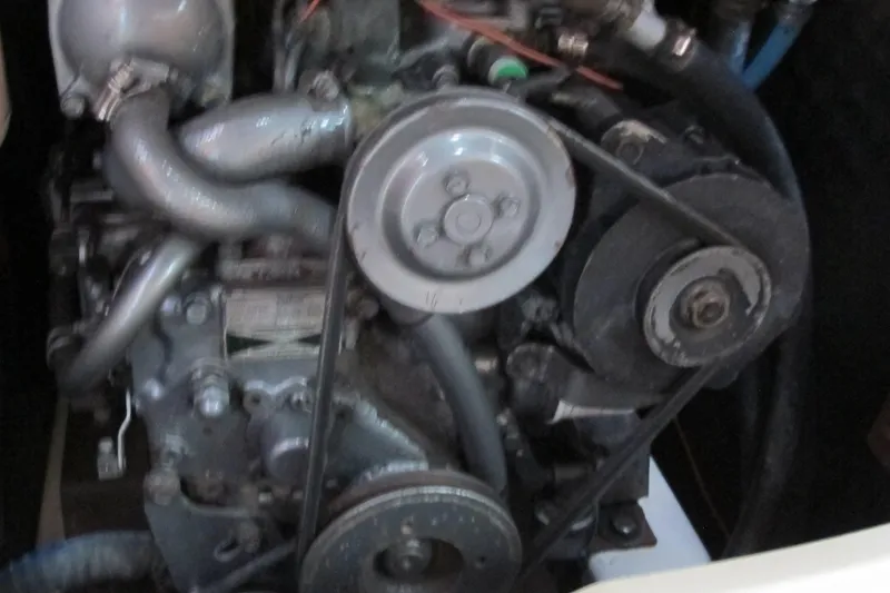 Slide: The Image of Engine of a 2000 Beneteau Oceanis 361 sailboat, showing belts and pulleys. - 34