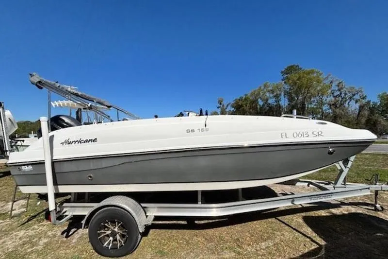 The Image of 2019 Hurricane SunDeck Sport 188 OB boat on trailer, side view. - 0