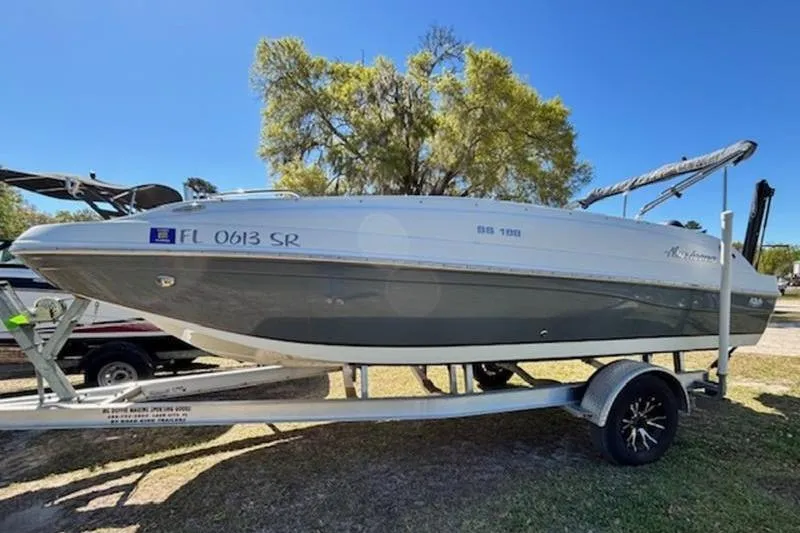 Slide: The Image of 2019 Hurricane SunDeck Sport 188 OB boat on trailer, parked outdoors. - 3